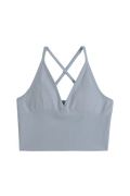 Lyseblå sømløs bralette fra aim'n med kryssede ryggstropper og ribbestrikket kant til trening.